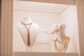 Luxury-Gold-Jewelry-on-Set-Holders-and-in-Jewelry-Box-on-Light-Dressing-Table-and-Wardrobe-Shelves_edited